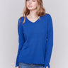 Sapphire blue V-neck sweater with long sleeves featuring side slits, made from plushy yarn by Charlie B.