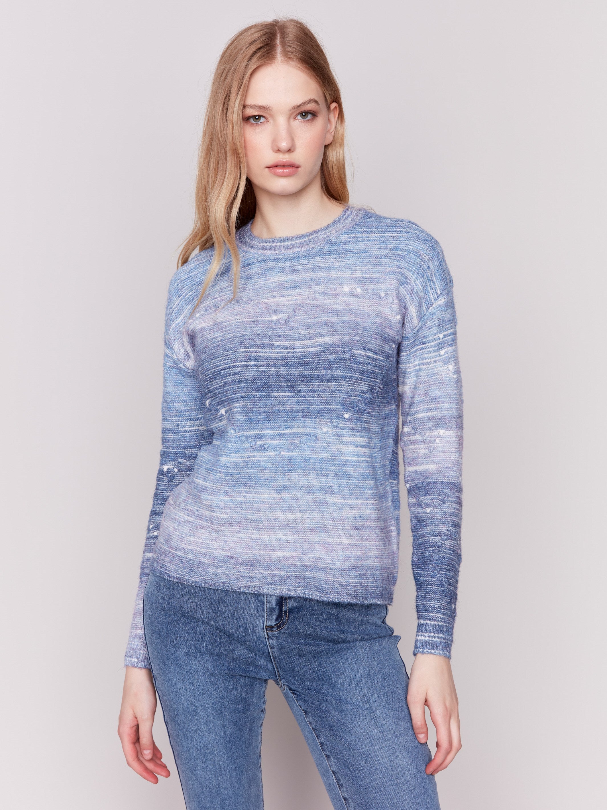 Blue space dye knit sweater with drop shoulders and a crew neckline by Charlie B.