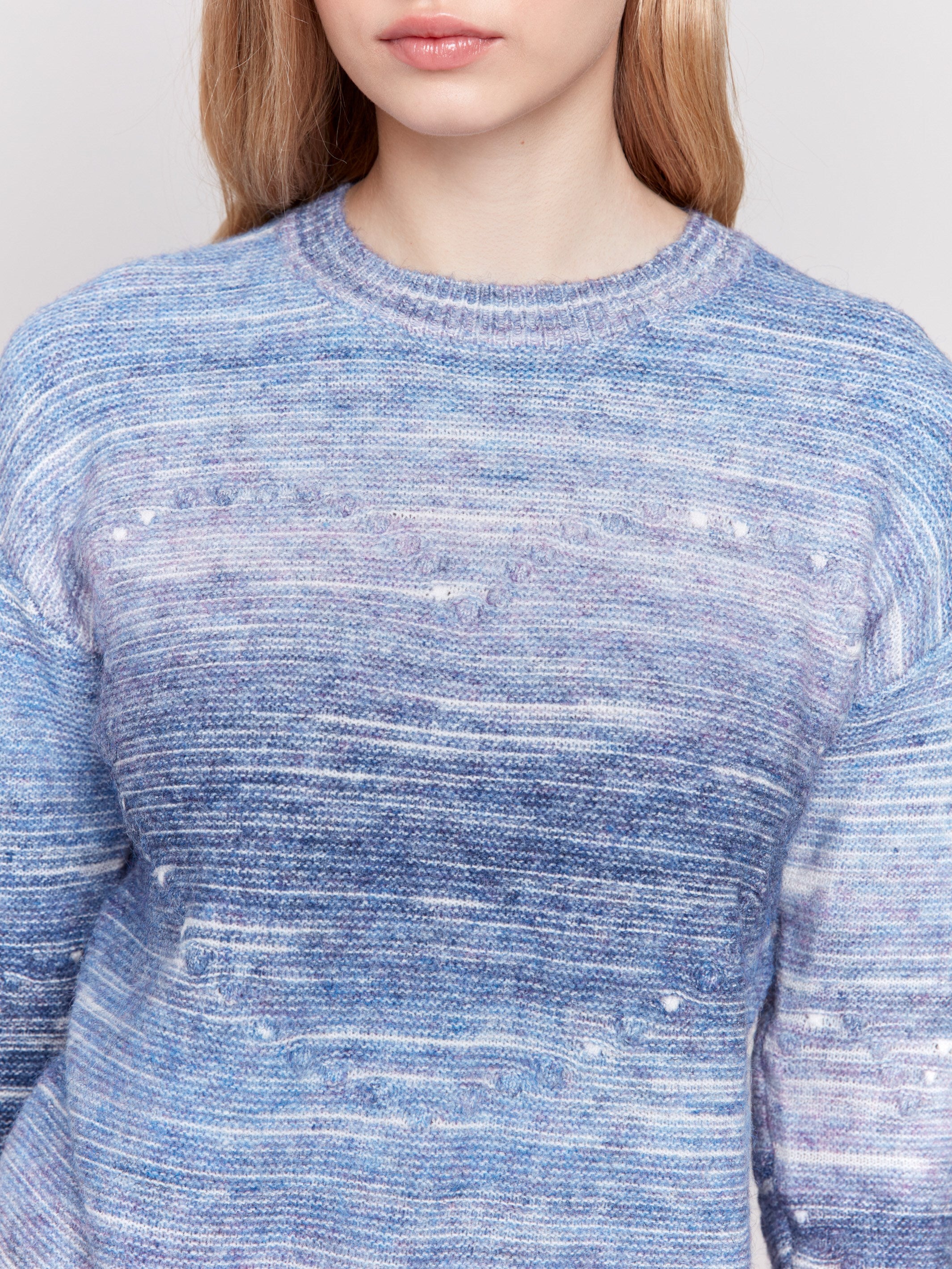 Blue space dye knit sweater with drop shoulders and a crew neckline by Charlie B.