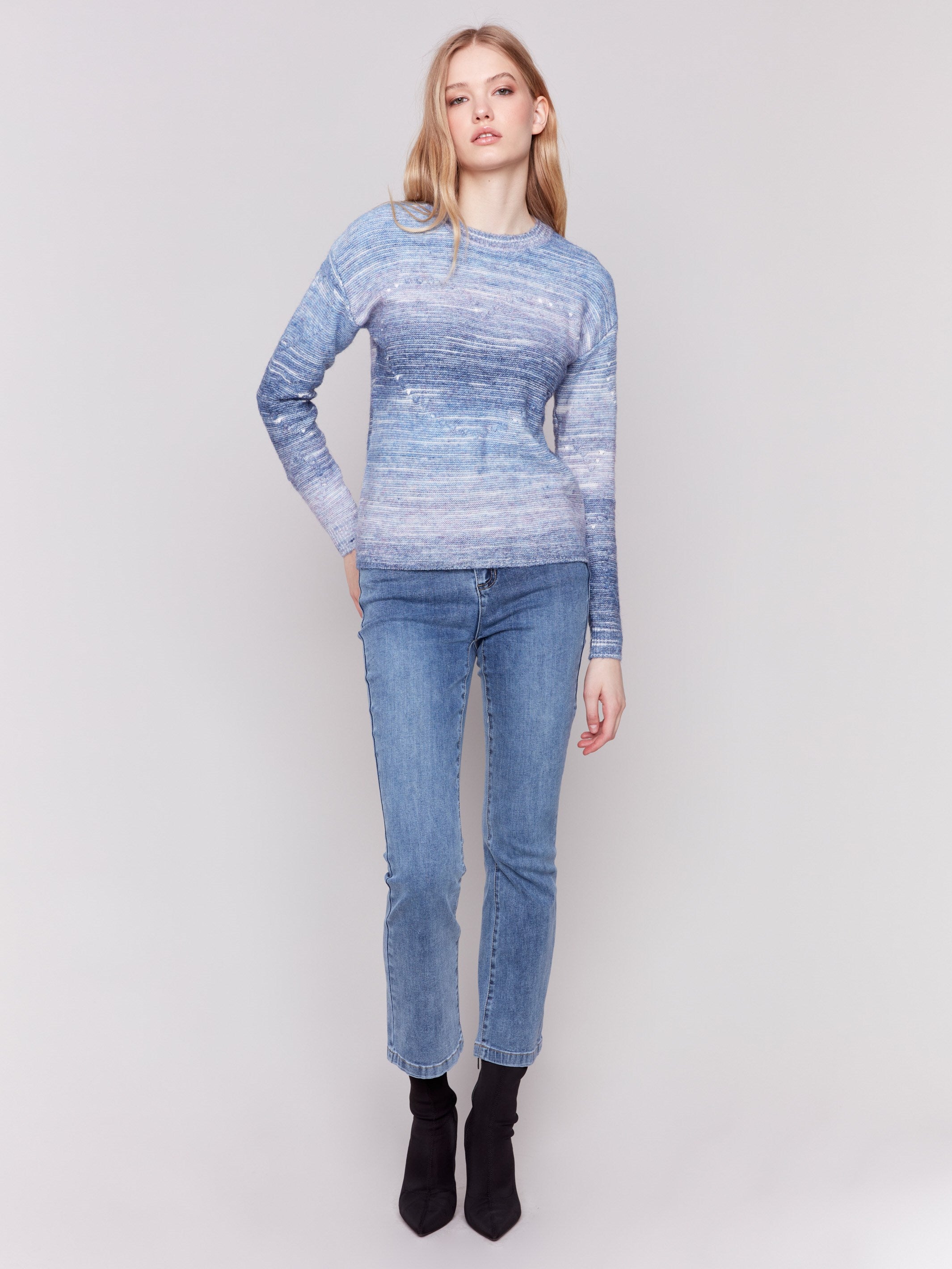 Blue space dye knit sweater with drop shoulders and a crew neckline by Charlie B.