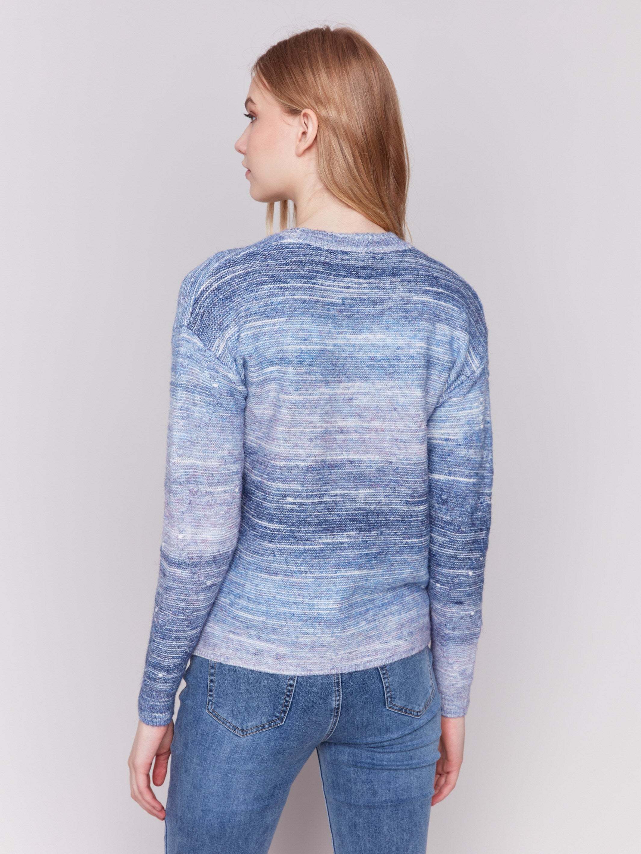 Blue space dye knit sweater with drop shoulders and a crew neckline by Charlie B.