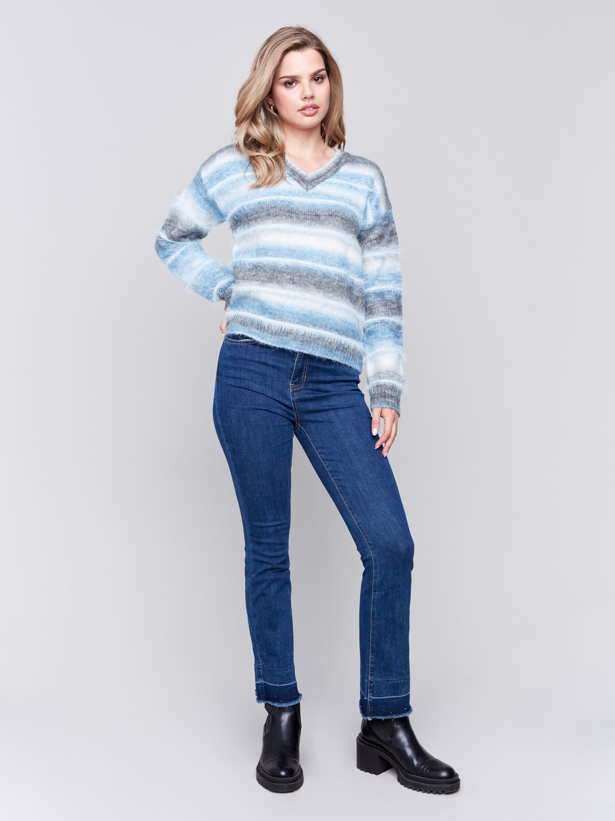 Frost-colored sweater with a subtle V-neck and a striped pattern made of eyelash yarn by Charlie B.