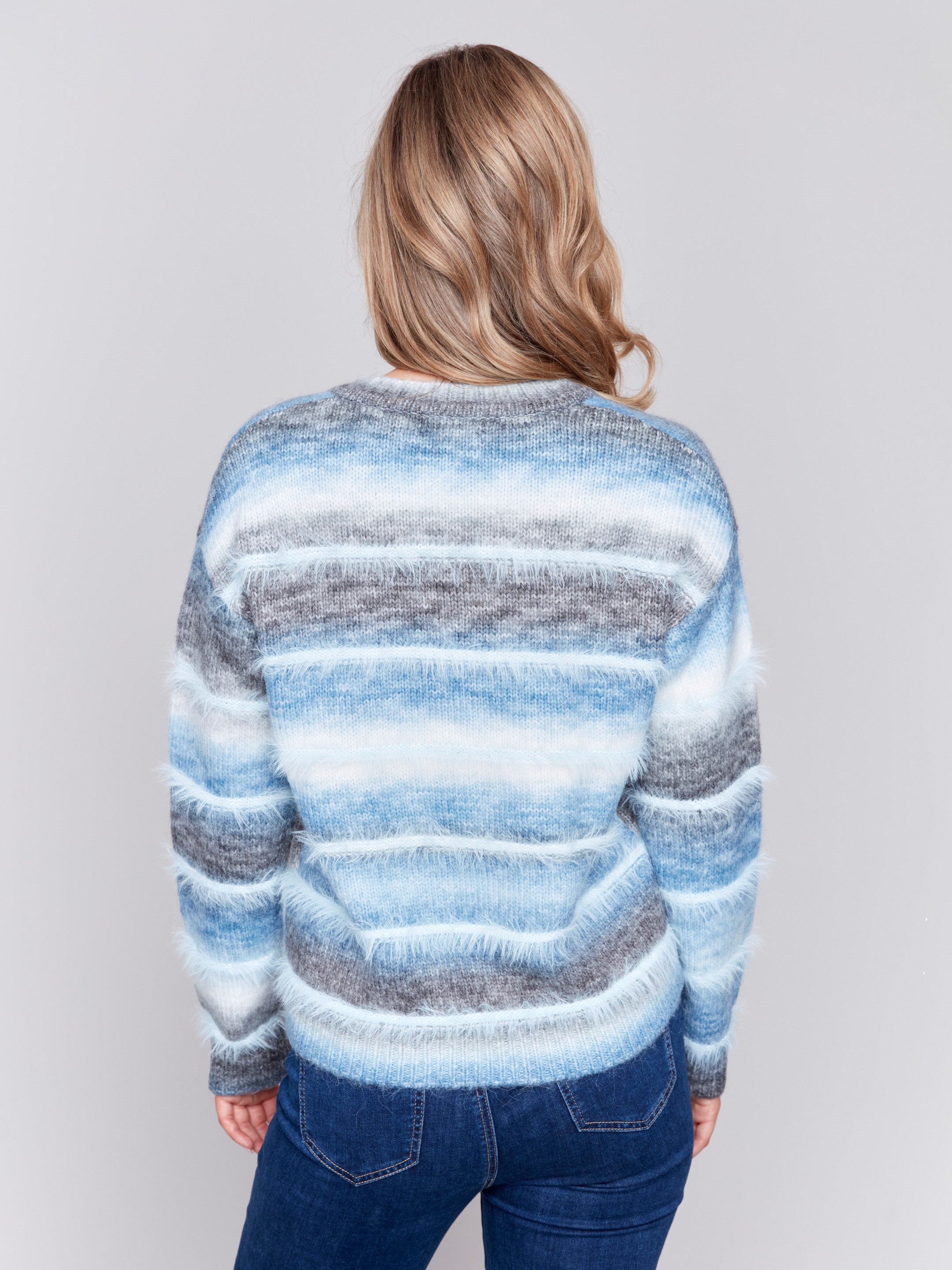 Frost-colored sweater with a subtle V-neck and a striped pattern made of eyelash yarn by Charlie B.