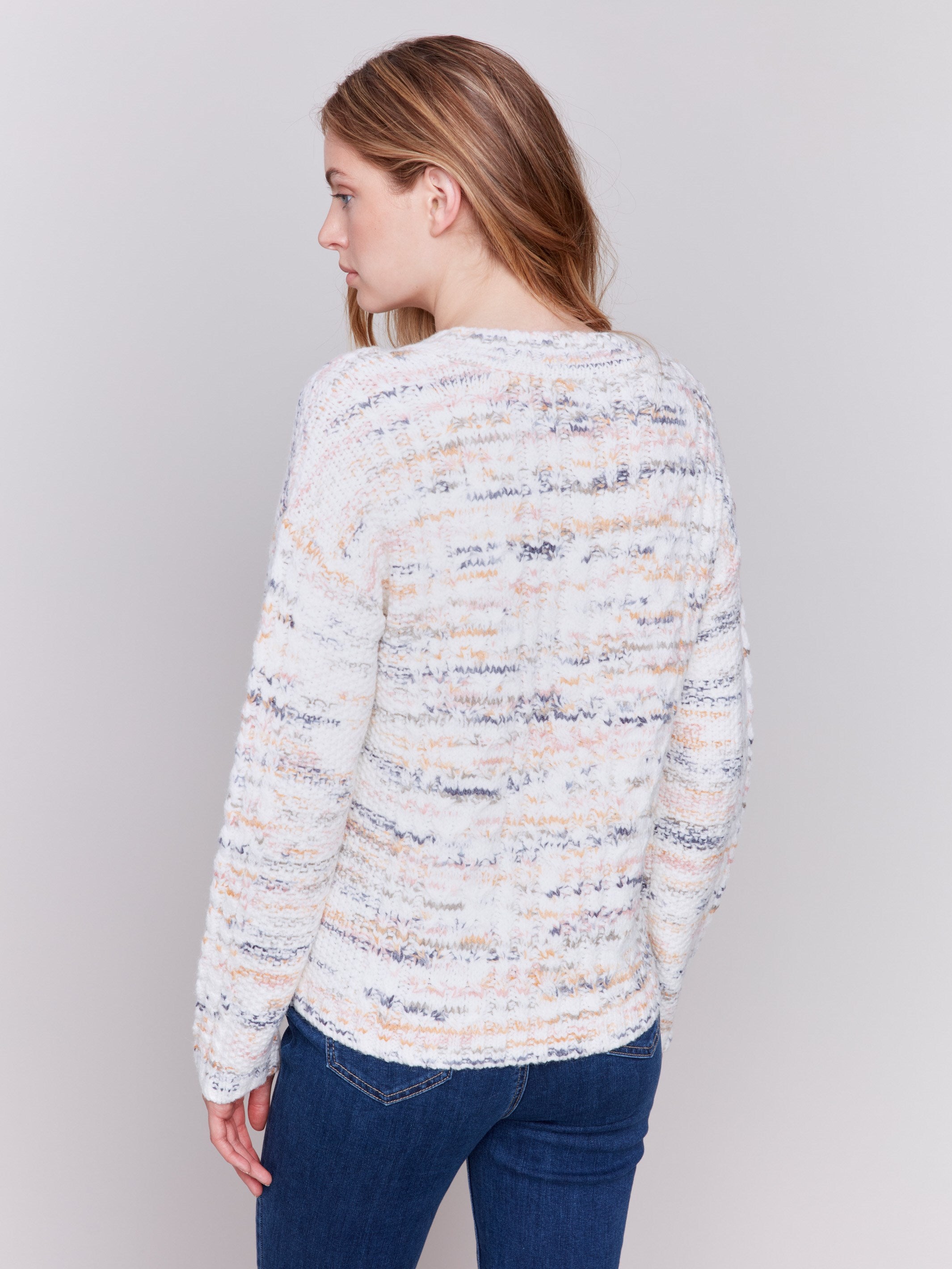 Speckled yarn cable knit sweater with a notched neckline and long sleeves in Ecru white by Charlie B.