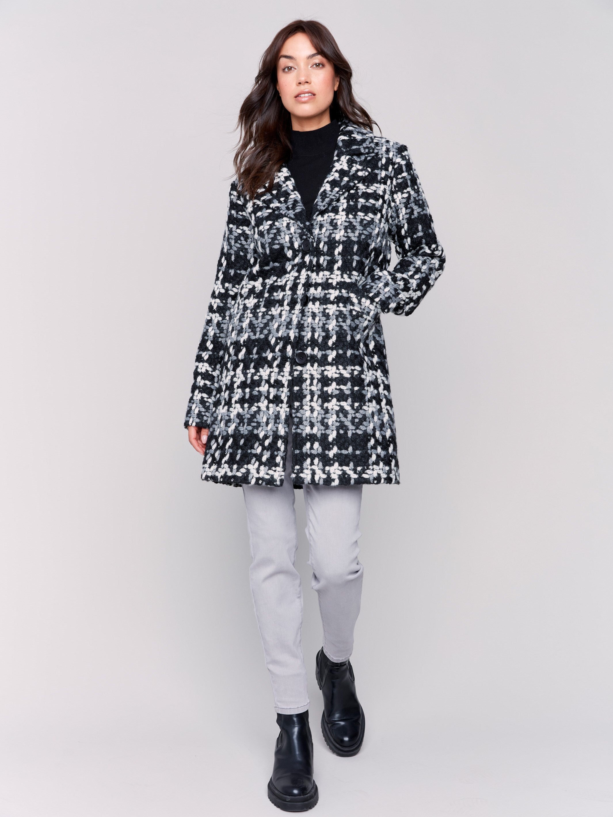 Straight-cut black & white plaid bouclé knit coat with button front closure and patch pockets by Charlie B.