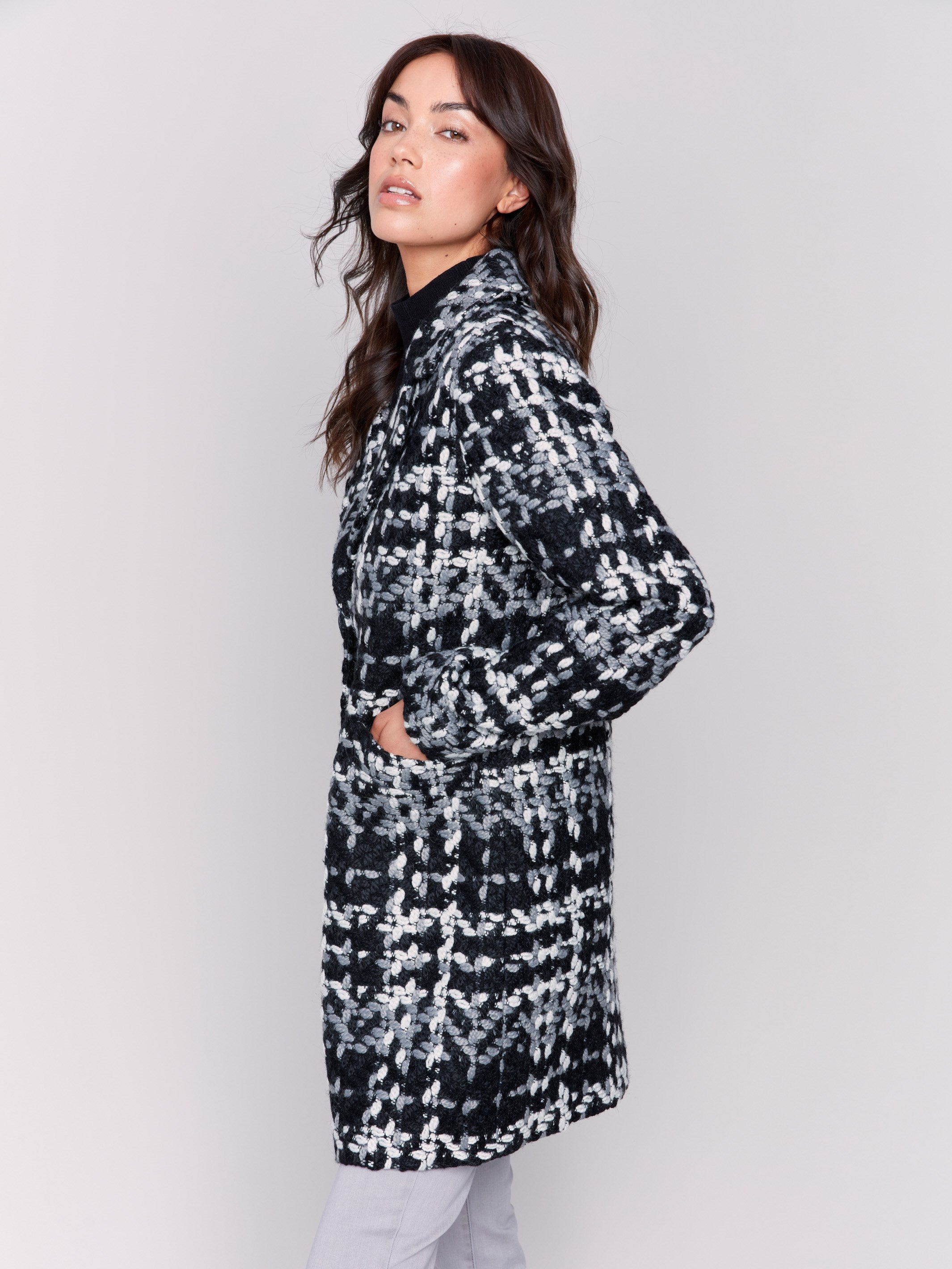 Straight-cut black & white plaid bouclé knit coat with button front closure and patch pockets by Charlie B.