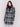 Straight-cut black & white plaid bouclé knit coat with button front closure and patch pockets by Charlie B.