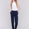 Navy straight-leg pants with a slim leg design, highlighted by a classic zip and button closure, belt loops, and side pockets, by Charlie B.