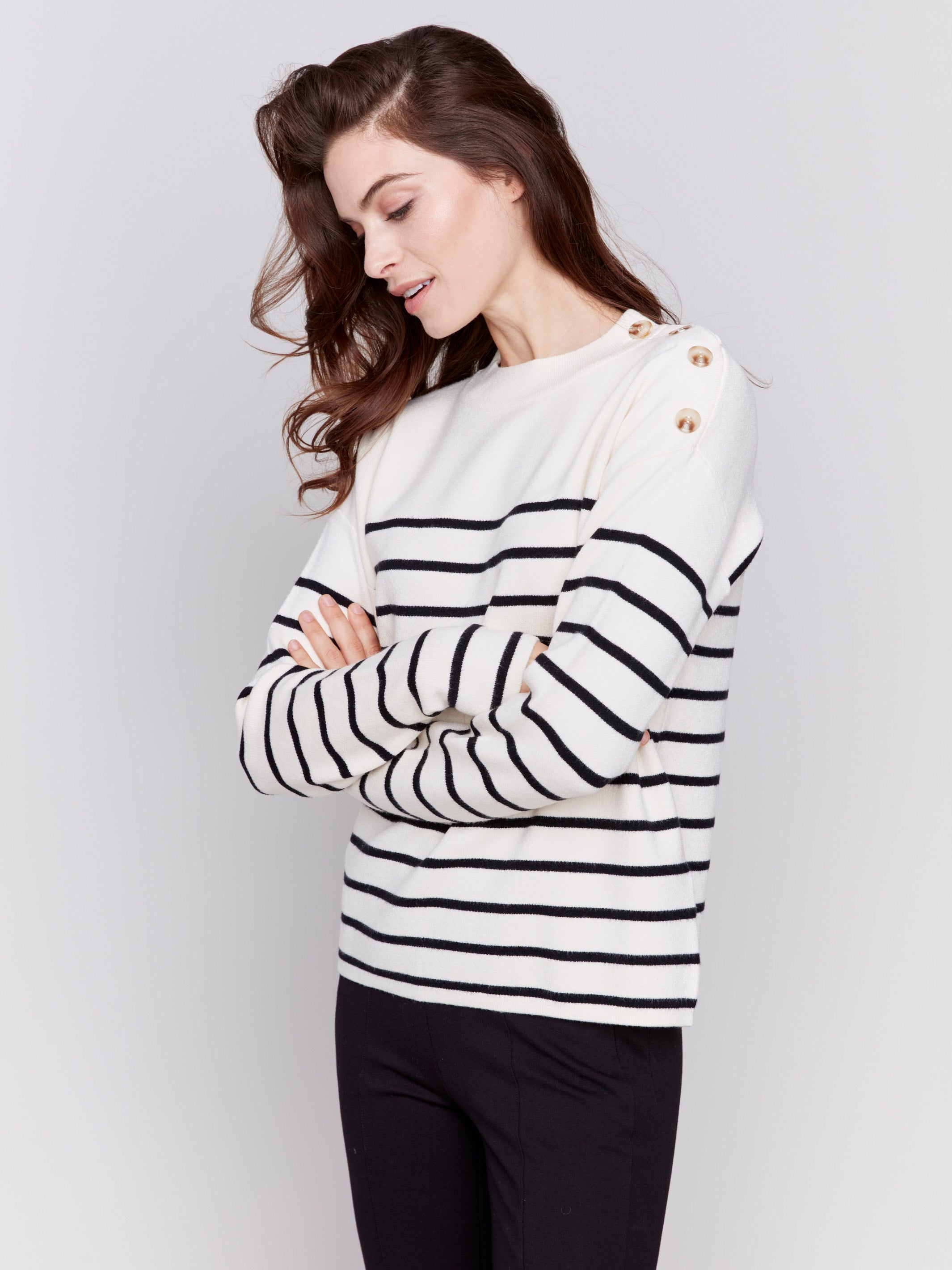 Ecru white striped sweater with button details on the shoulder and a crew neckline by Charlie B.