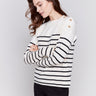 Ecru white striped sweater with button details on the shoulder and a crew neckline by Charlie B.