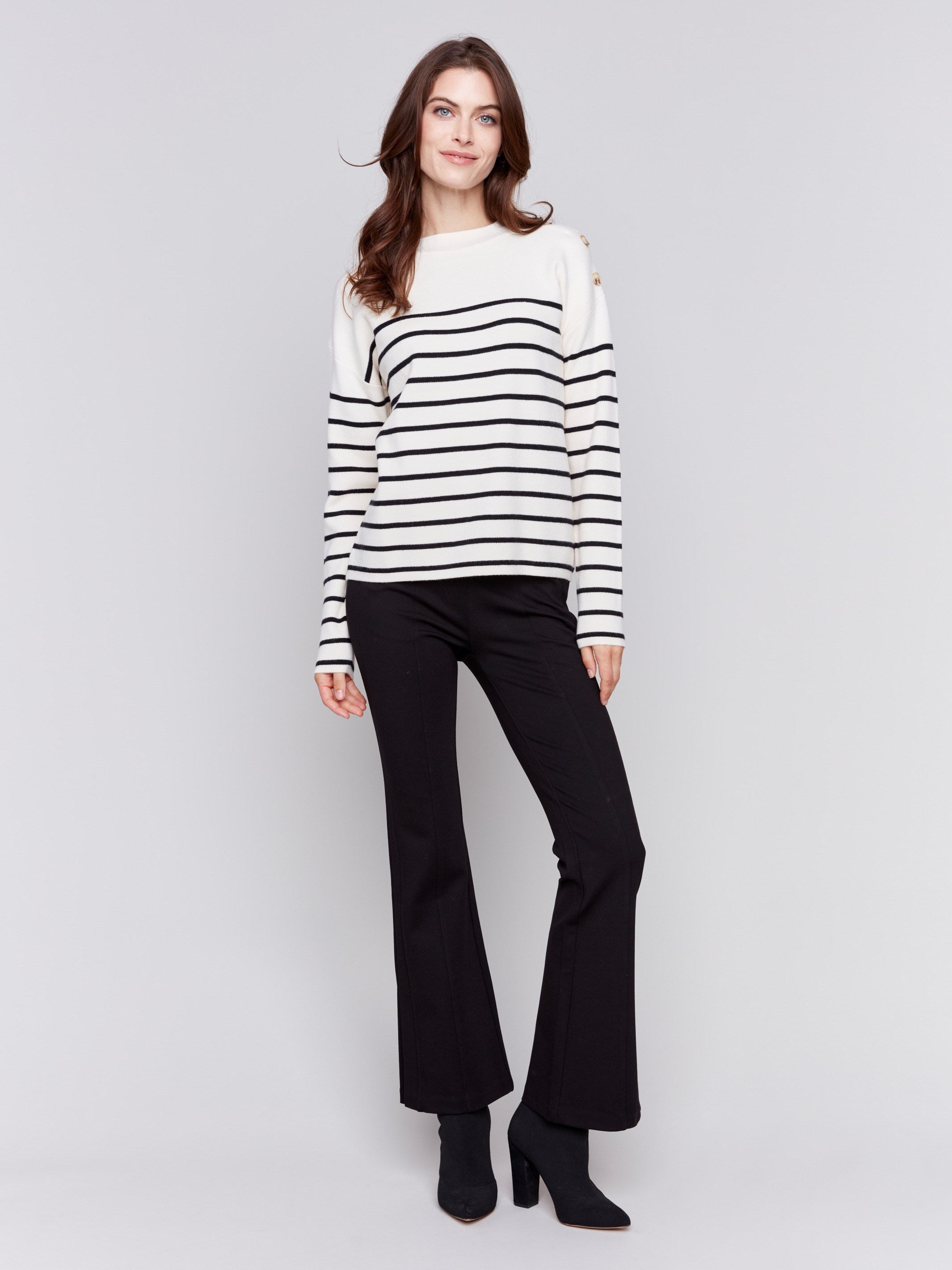 Ecru white striped sweater with button details on the shoulder and a crew neckline by Charlie B.