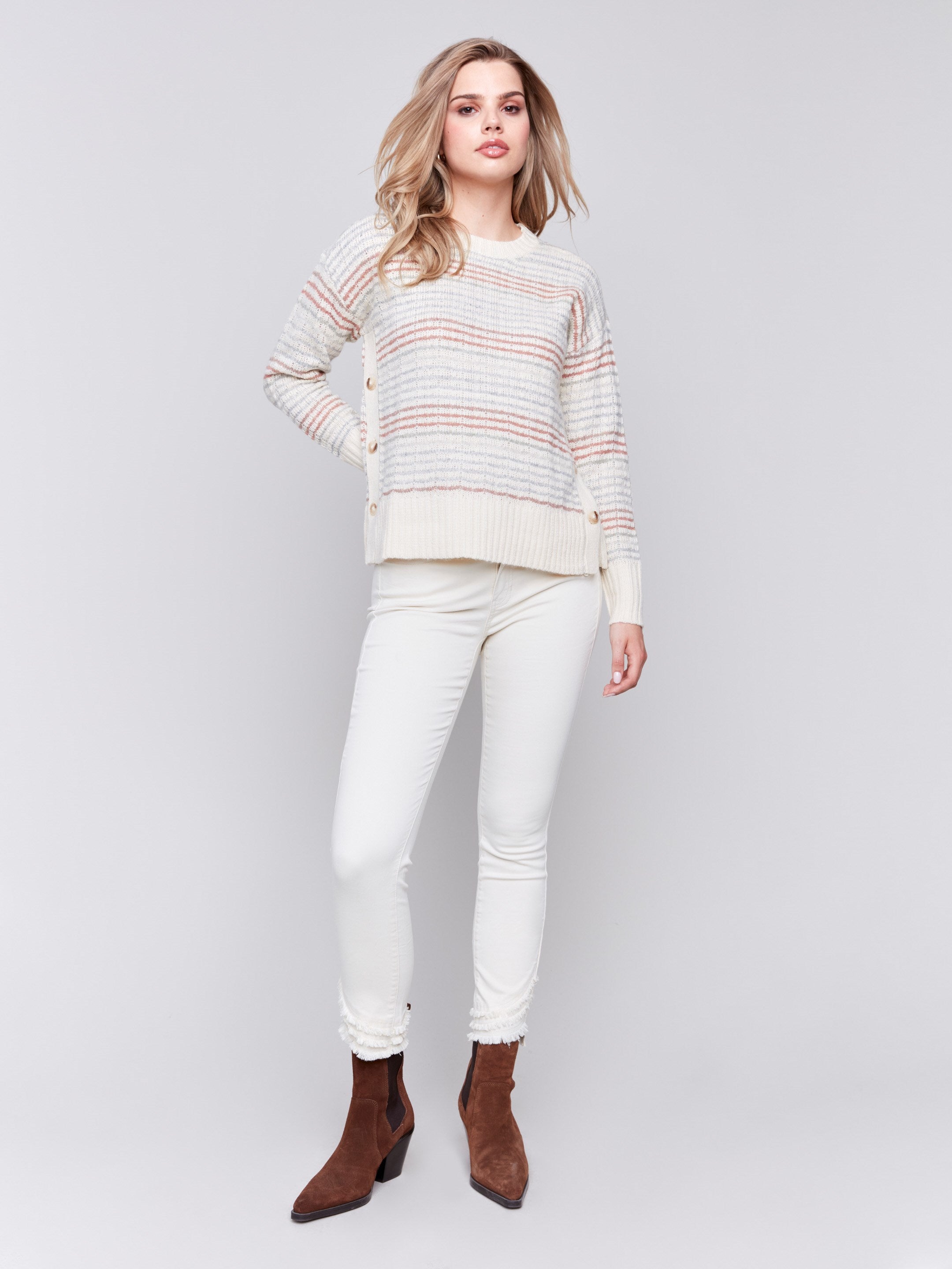 Ecru crew neck striped sweater with pastel stripes and side button detailing by Charlie B.