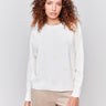 Off-white long-sleeve sweater with faux fur polka dots and a crew neckline by Charlie B.