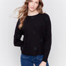 Black long-sleeve sweater with faux fur polka dots and a crew neckline by Charlie B.