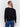 Black long-sleeve sweater with faux fur polka dots and a crew neckline by Charlie B.