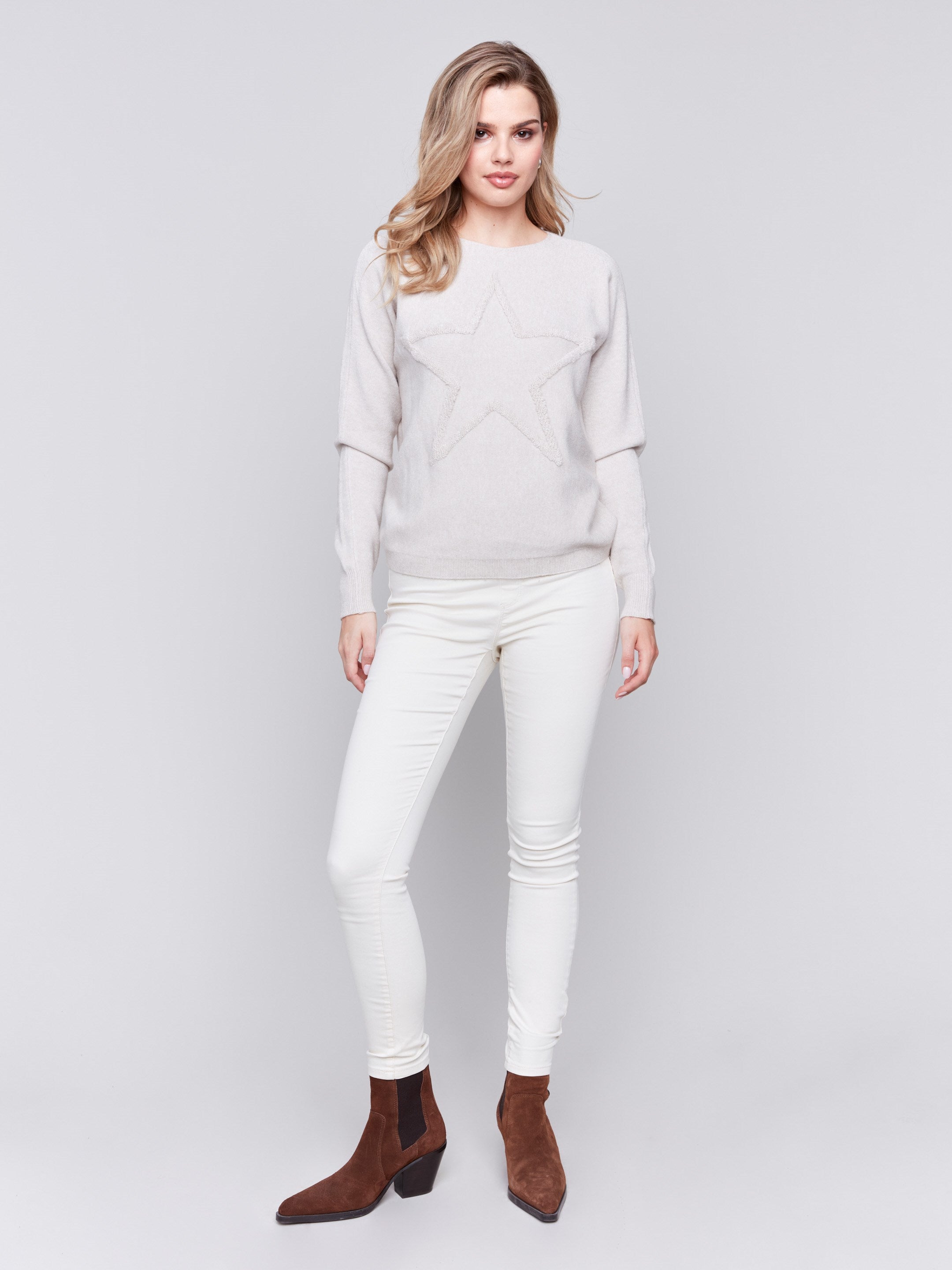 Heather almond long-sleeve sweater with fringed embroidery, featuring a round neckline and ribbed cuffs by Charlie B.