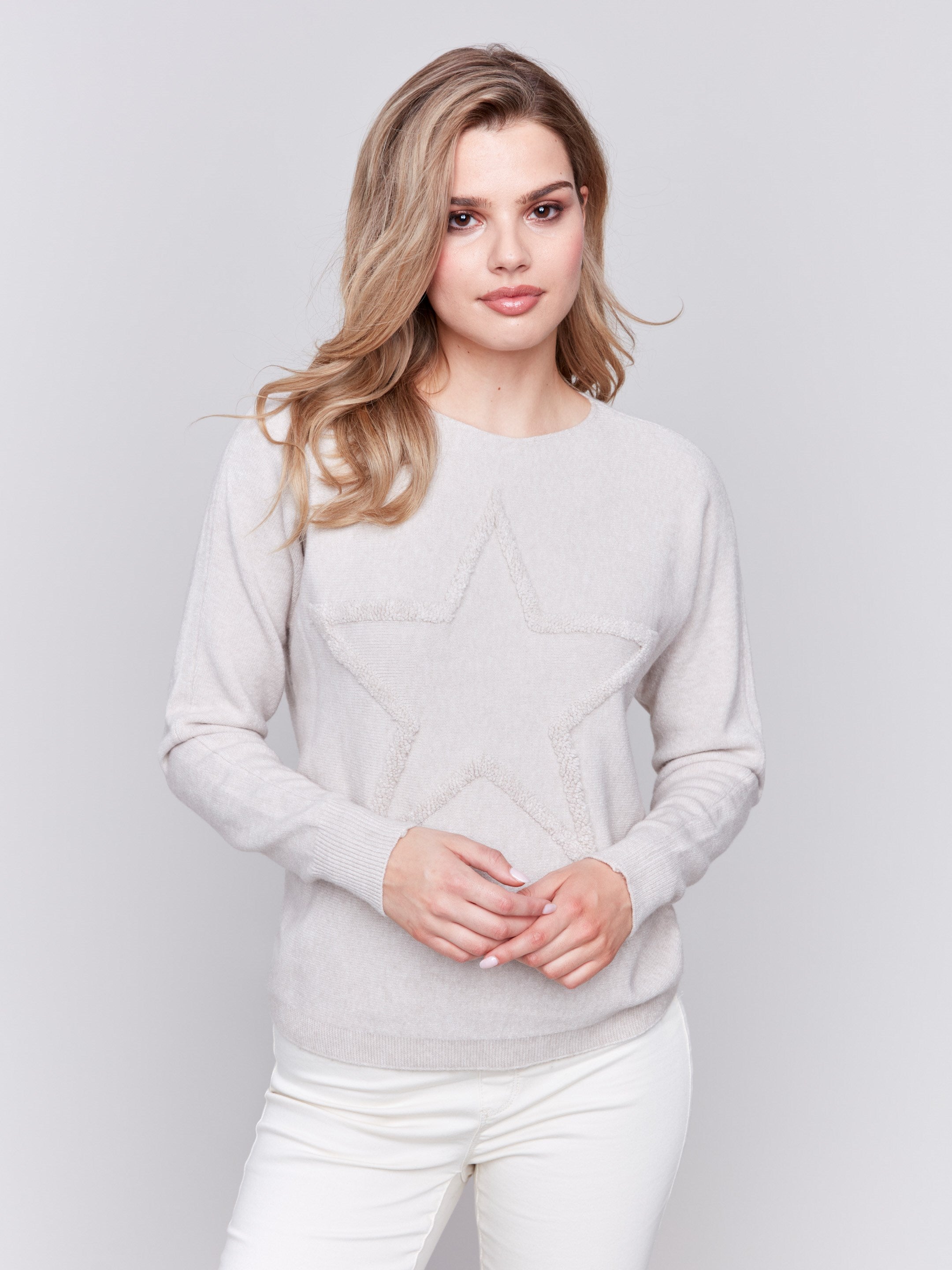 Heather almond long-sleeve sweater with fringed embroidery, featuring a round neckline and ribbed cuffs by Charlie B.