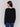 Black long-sleeve sweater with fringed embroidery, featuring a round neckline and ribbed cuffs by Charlie B.