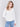 Ecru white long-sleeve sweater with front knot detail and V-neckline by Charlie B.