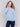 Frost blue long-sleeve sweater with front knot detail and V-neckline by Charlie B.