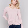 Light pink long-sleeve sweater with front knot detail and V-neckline by Charlie B.