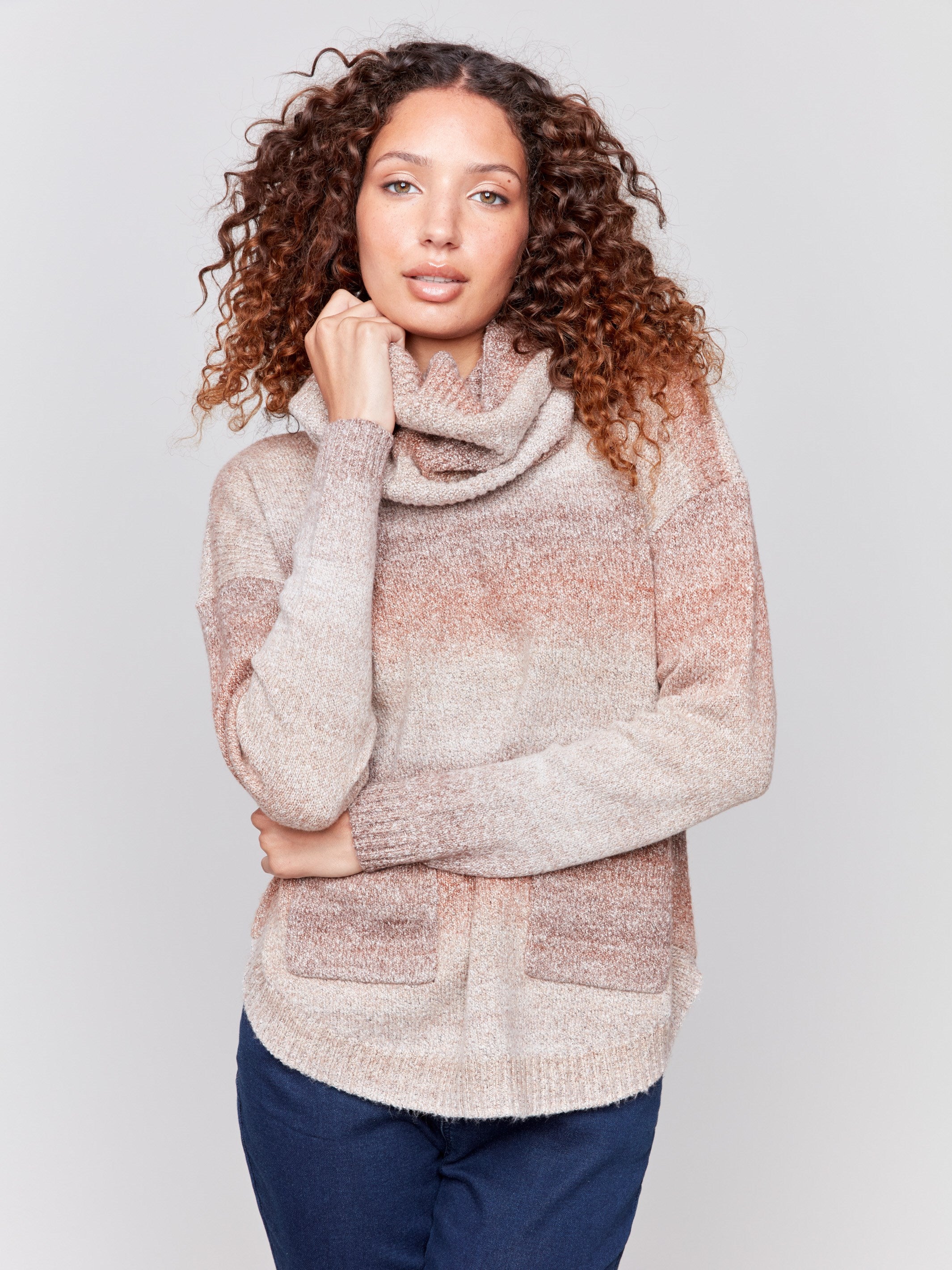 Sweater with removable scarf in a striped Timber print has a round hem and front pockets. Charlie B.