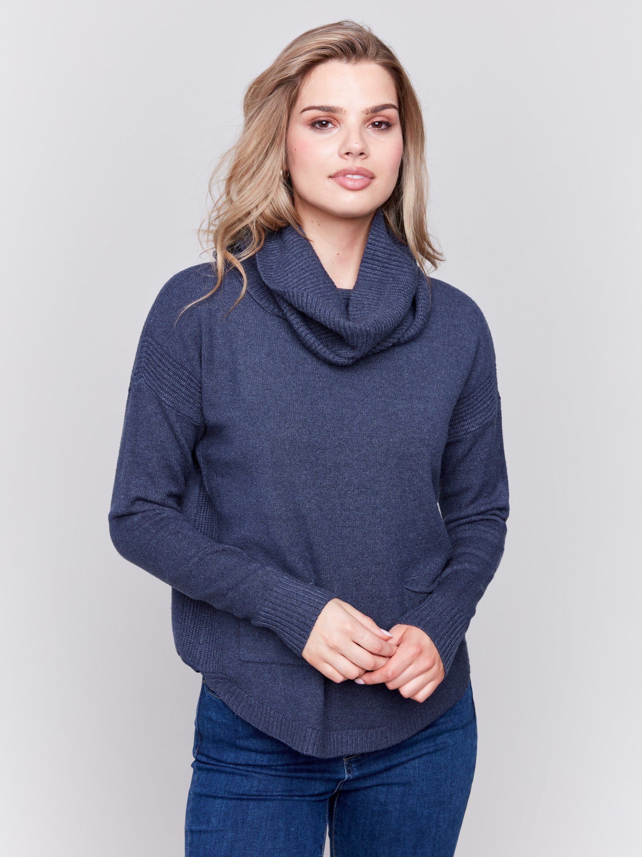 Dark blue round hem sweater with a removable scarf and front pockets by Charlie B.