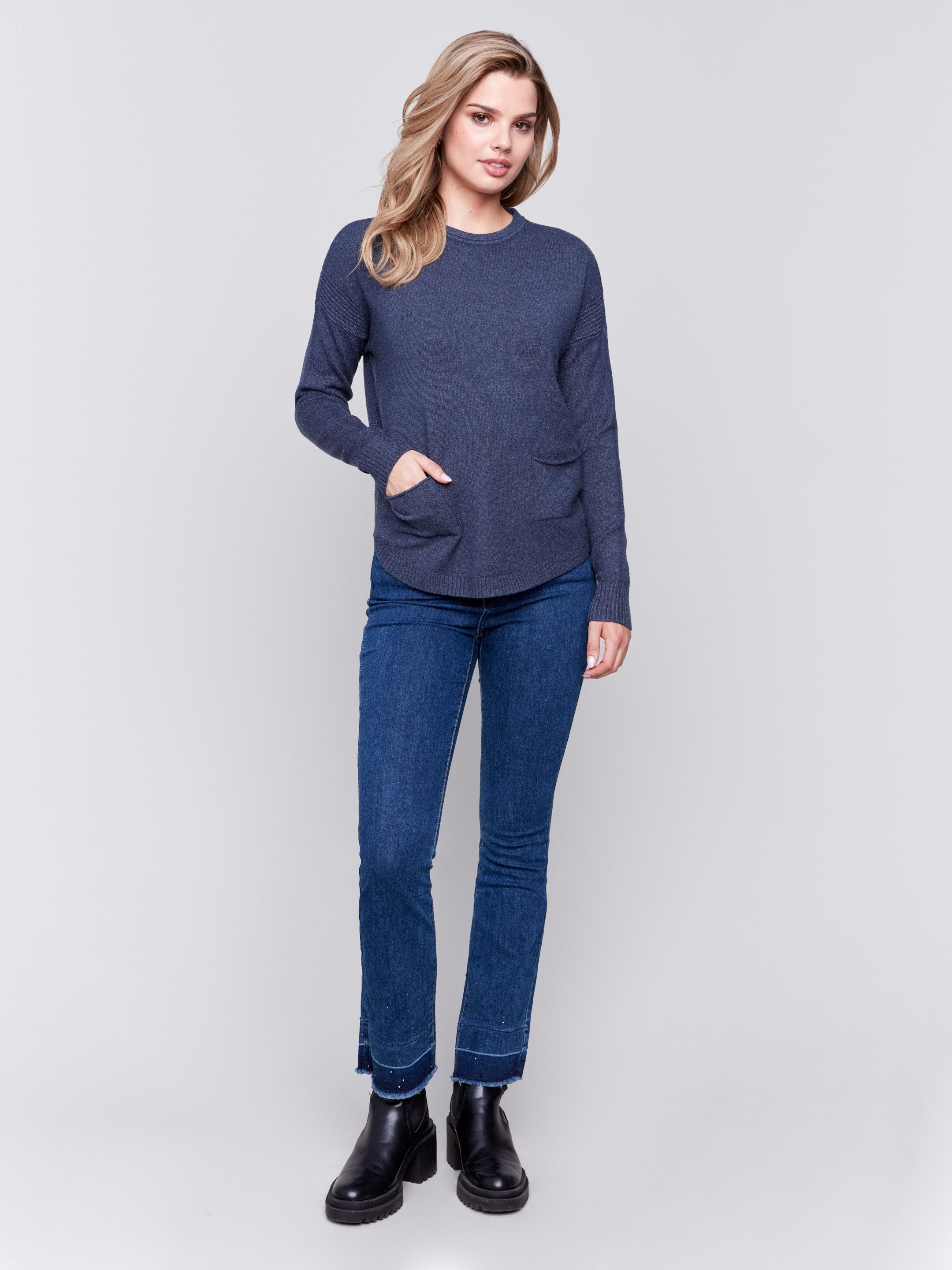 Dark blue round hem sweater with a removable scarf and front pockets by Charlie B.