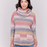 Sweater with removable scarf in a striped pink print has a round hem and front pockets. Charlie B.