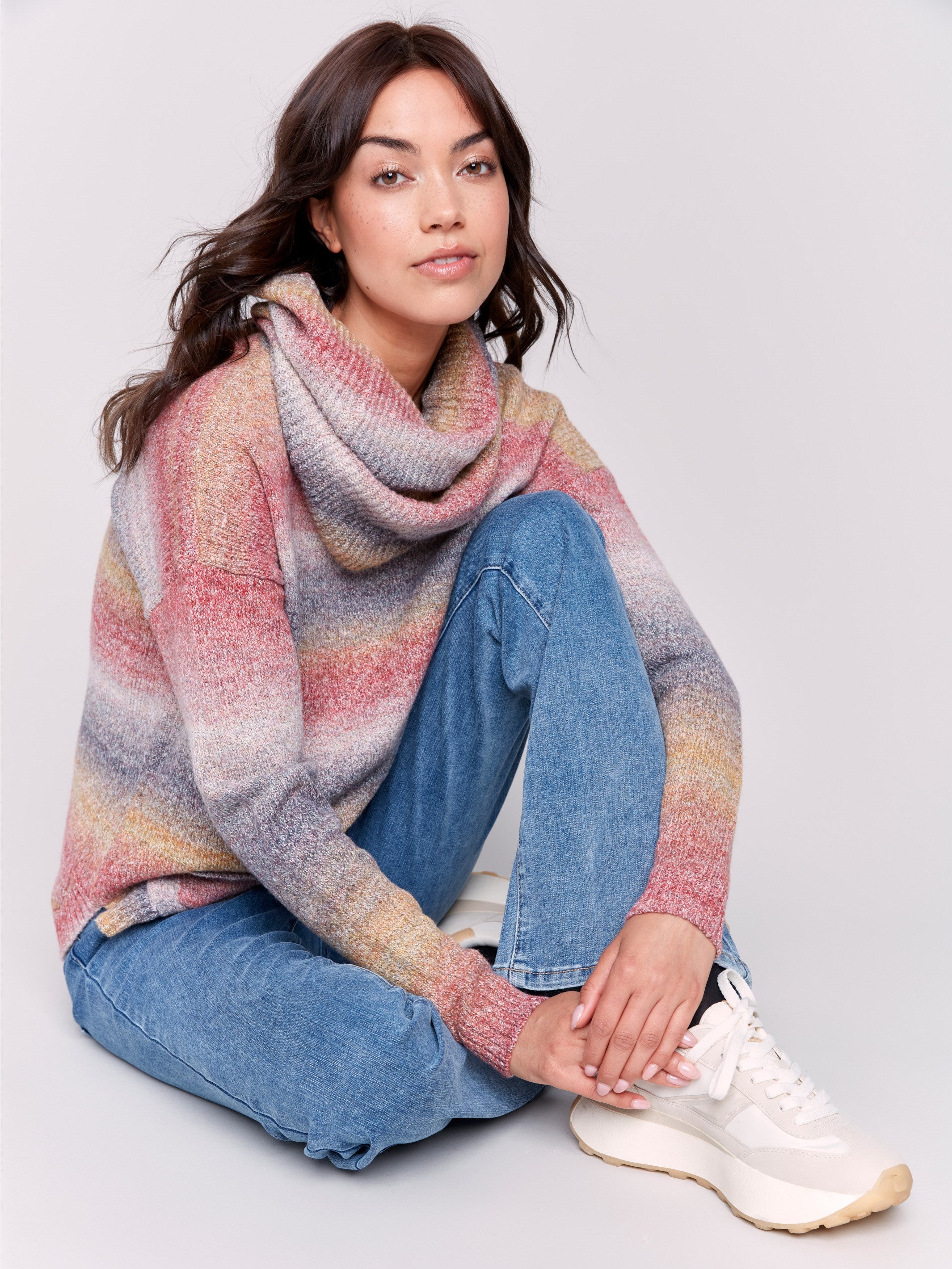 Sweater with removable scarf in a striped pink print has a round hem and front pockets. Charlie B.