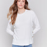 Cream white sweater with long sleeves and side button detailing by Charlie B.