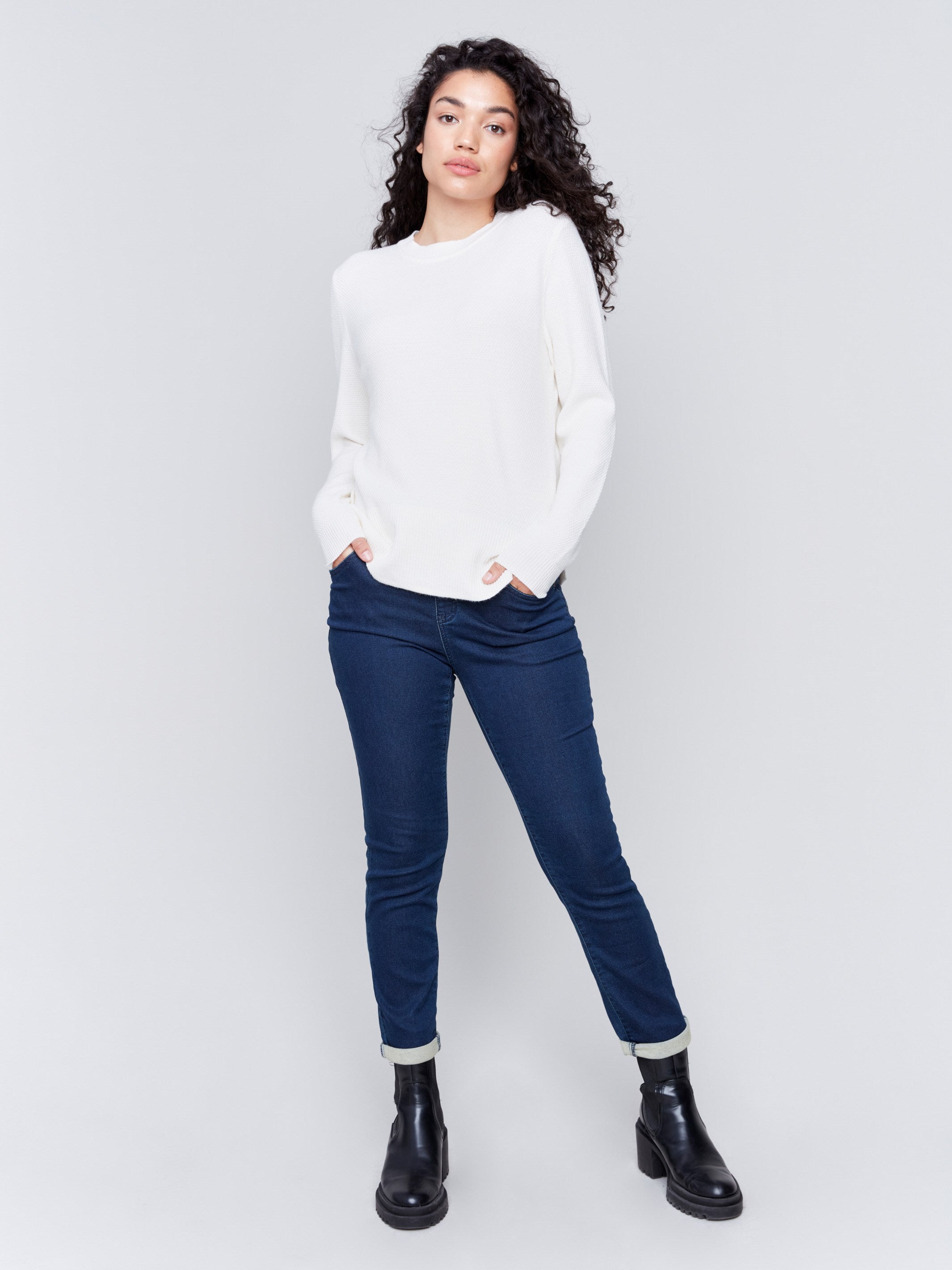 Ecru white sweater with long sleeves featuring side tab details and a round hem by Charlie B.