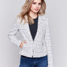 White tweed perfecto jacket with a lapel notch collar, side pockets, and hook-and-eye closure by Charlie B.