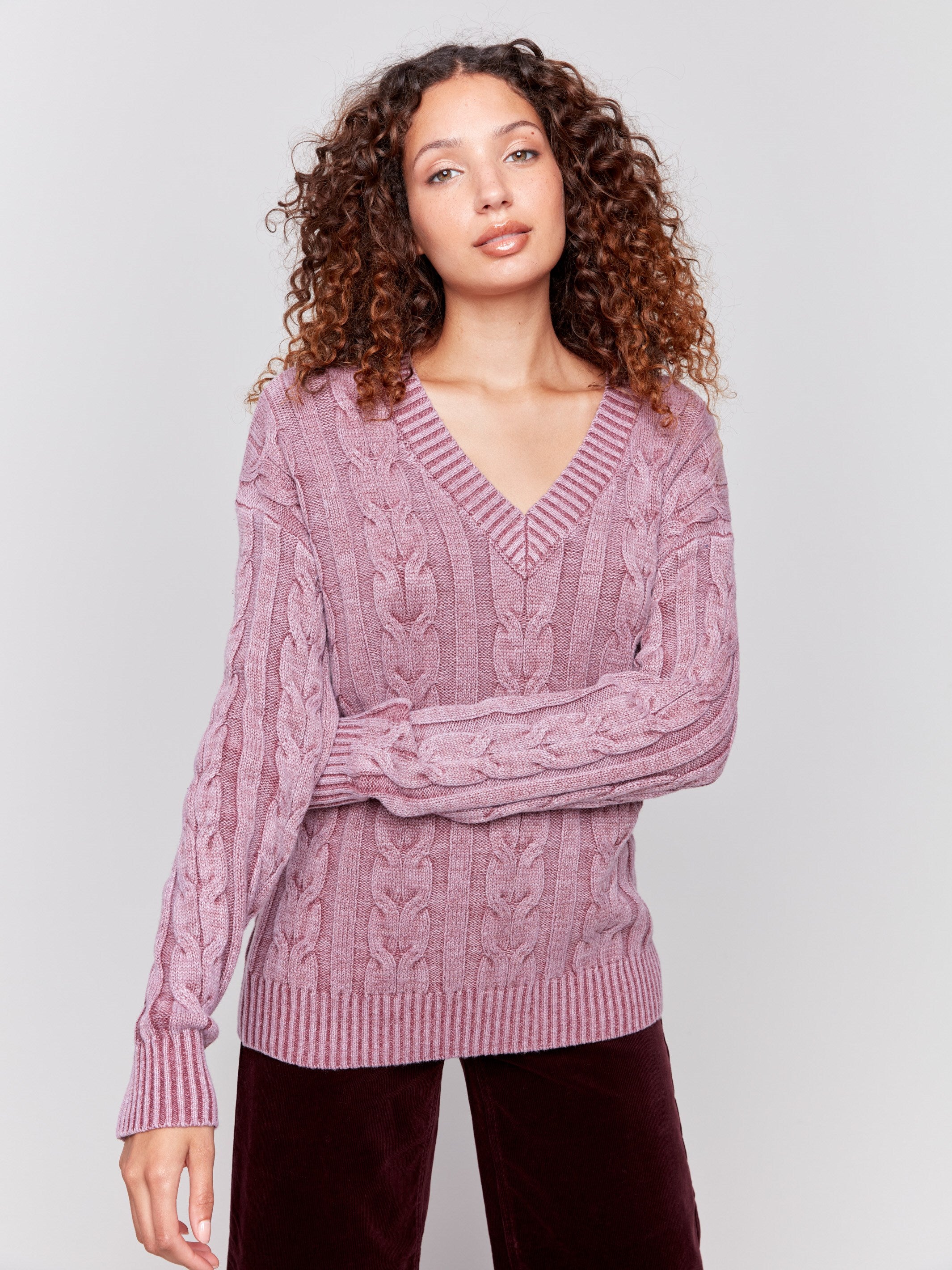 Cabernet cable knit sweater with a V-neckline, long sleeves, and geometric patterns by Charlie B.