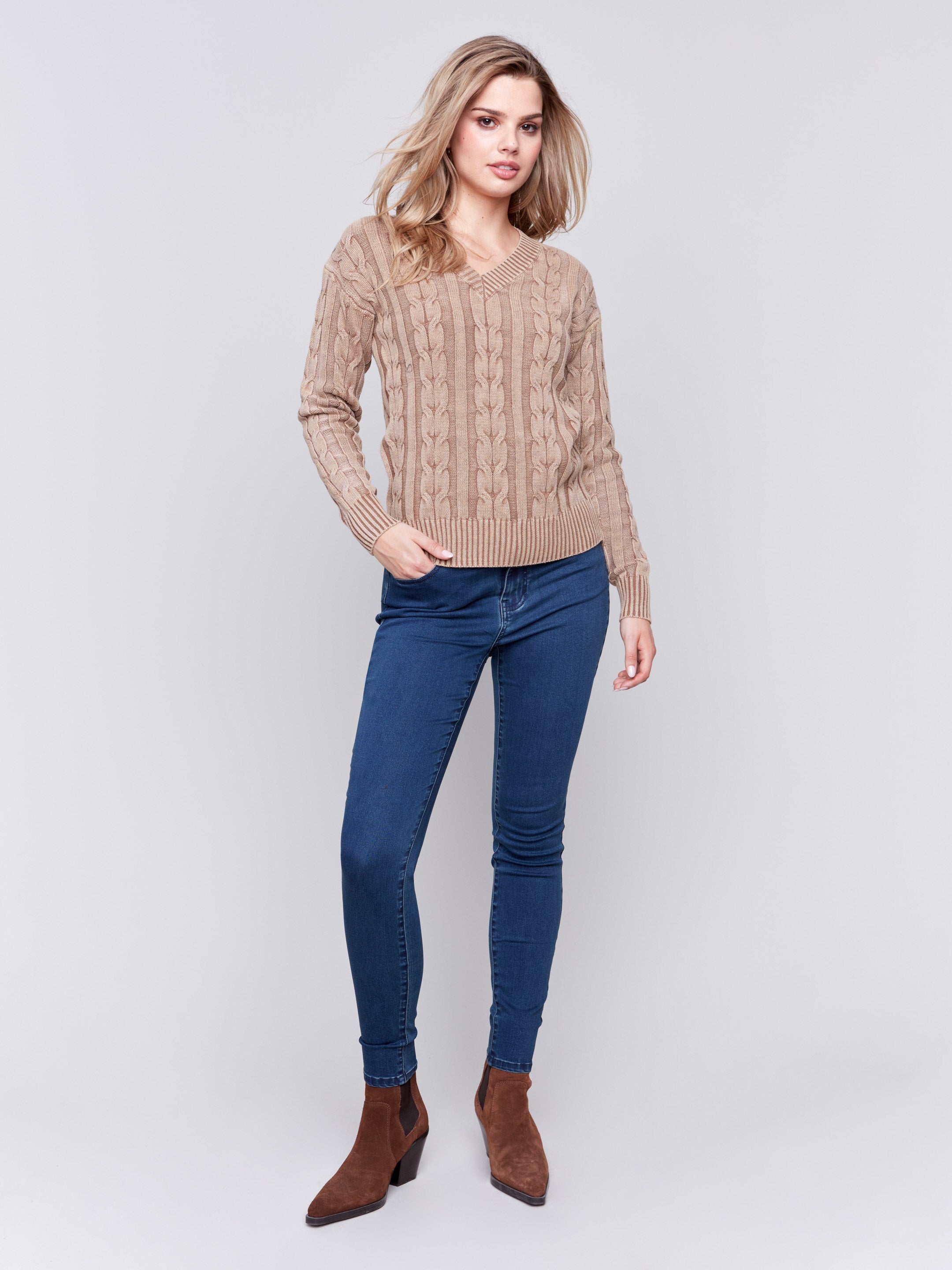 Truffle brown cable knit sweater with a V-neckline, long sleeves, and geometric patterns by Charlie B.