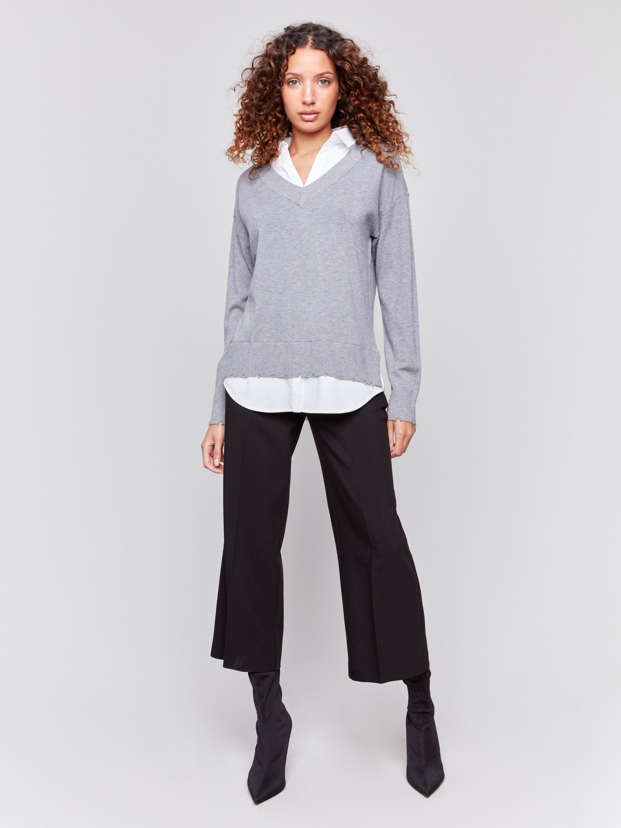 Grey V-neck fooler sweater with white shirt collar, featuring a shirttail hem and side slits by Charlie B.