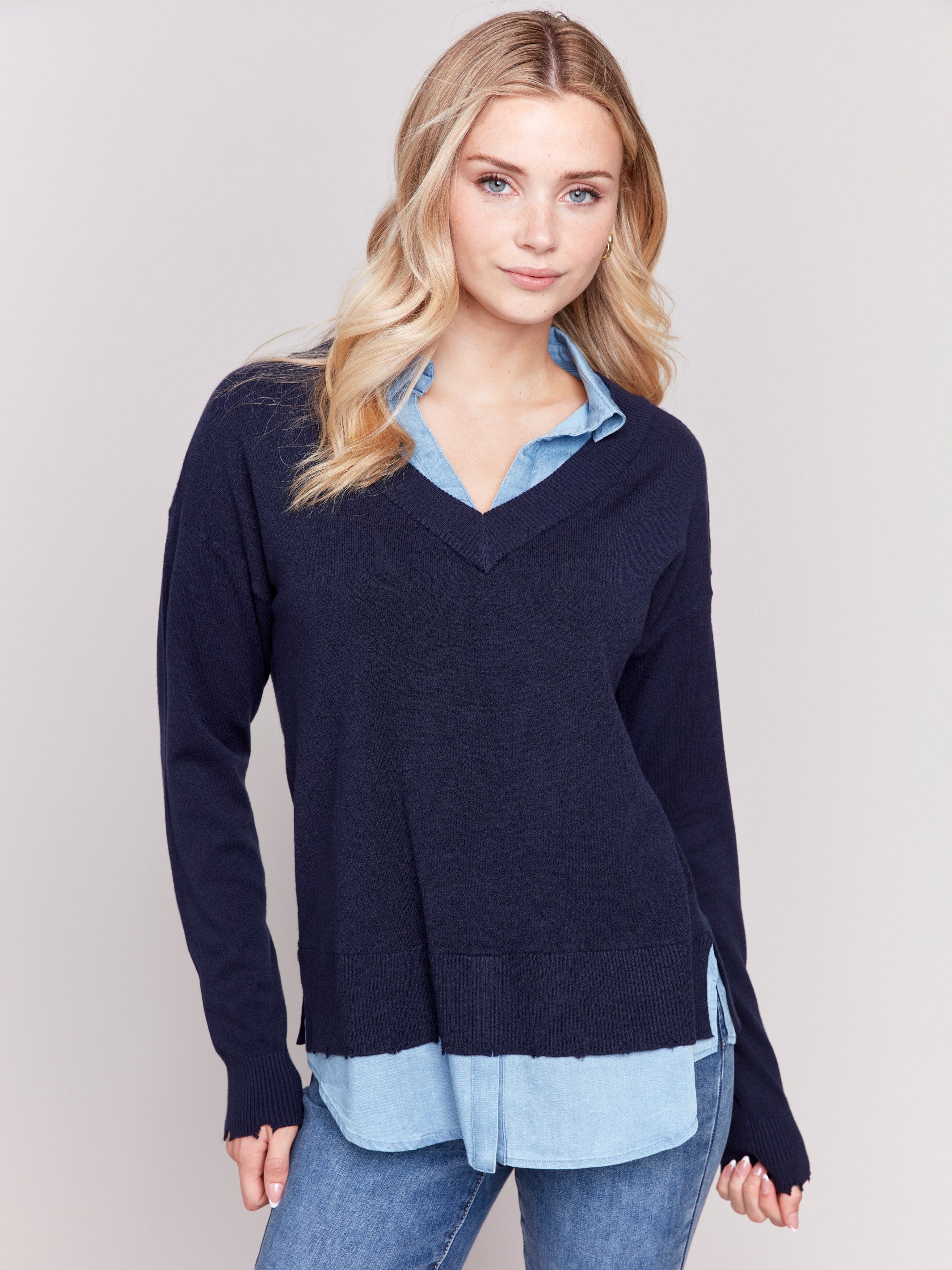 Navy V-neck fooler sweater with chambray shirt collar and peeking details at the hem and cuffs by Charlie B.