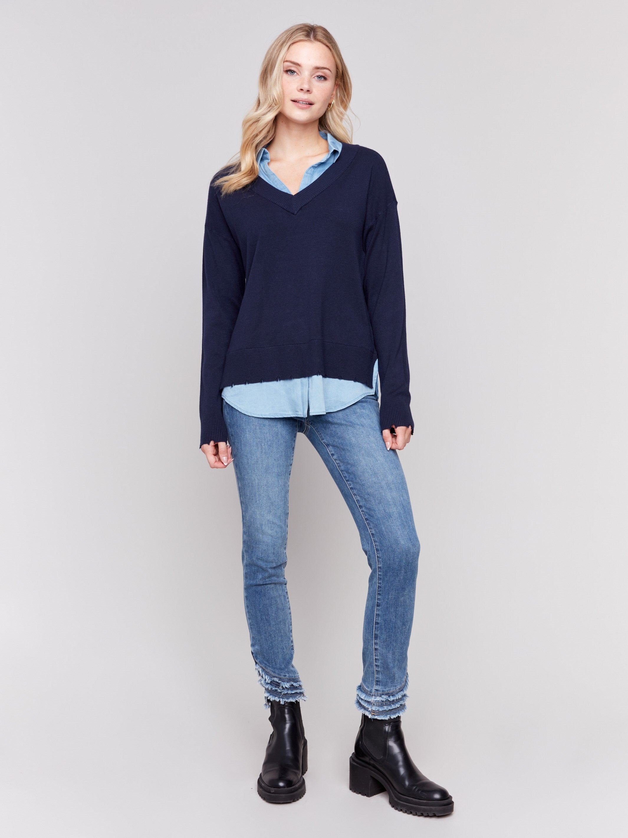 Navy V-neck fooler sweater with chambray shirt collar and peeking details at the hem and cuffs by Charlie B.