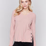 Heather woodrose V-neck sweater with long sleeves featuring grommet details at the side placket by Charlie B.