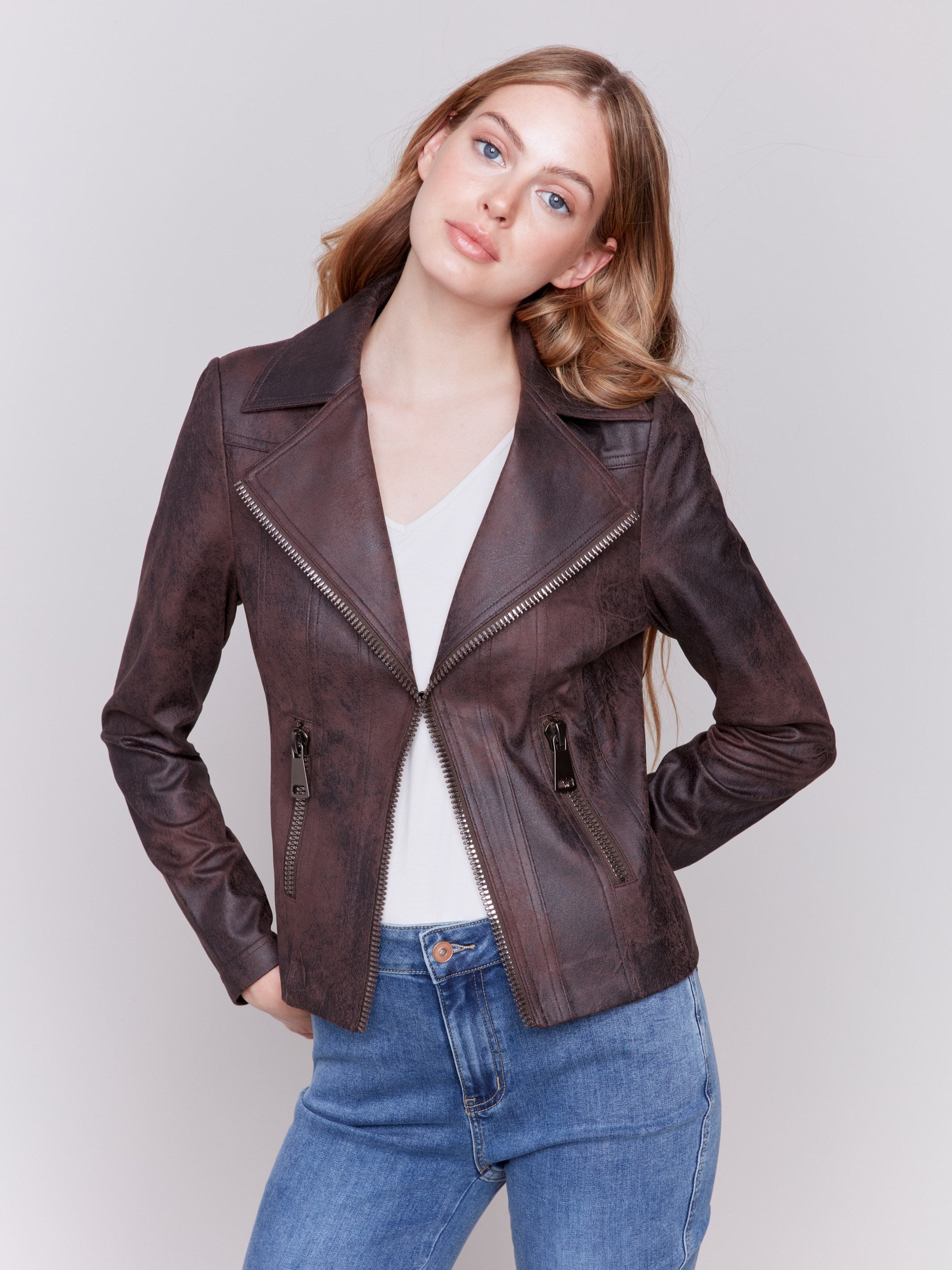 Mocha-colored faux leather biker jacket with zipper details and fake pockets by Charlie B.