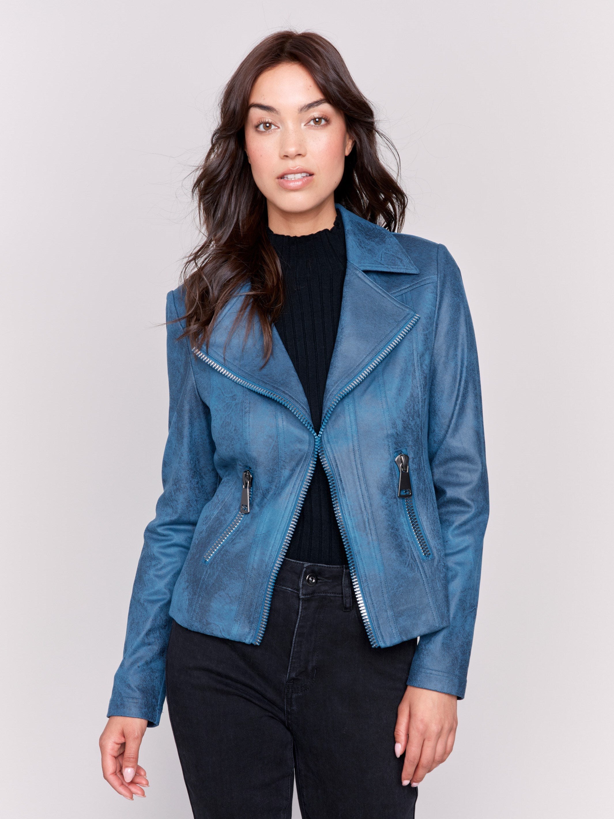 Peacock blue faux leather biker jacket with zipper details and fake pockets by Charlie B.