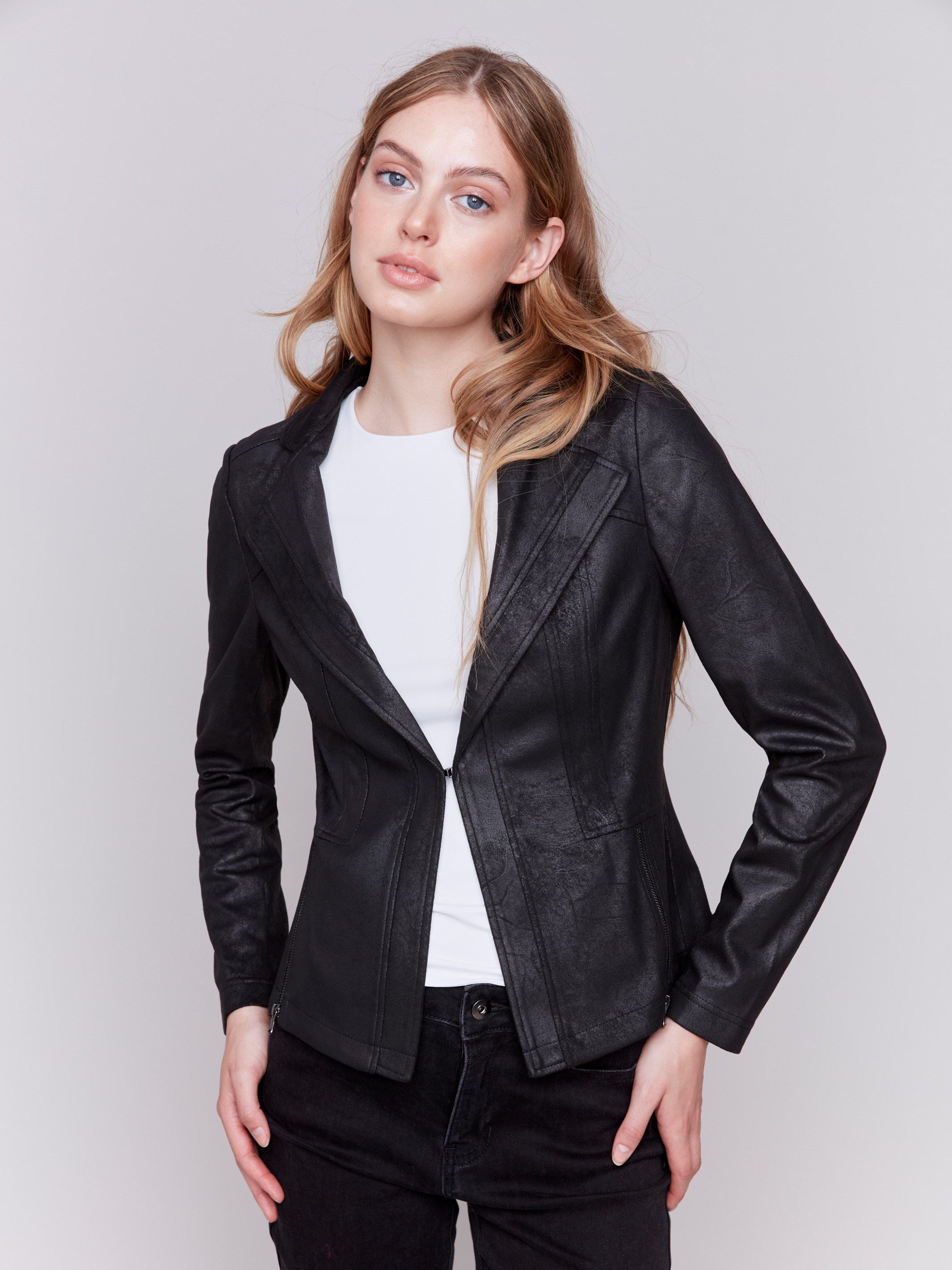 Vintage black faux leather motorcycle jacket with lapel notch collar and hook-and-eye closure by Charlie B.