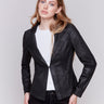 Vintage black faux leather motorcycle jacket with lapel notch collar and hook-and-eye closure by Charlie B.