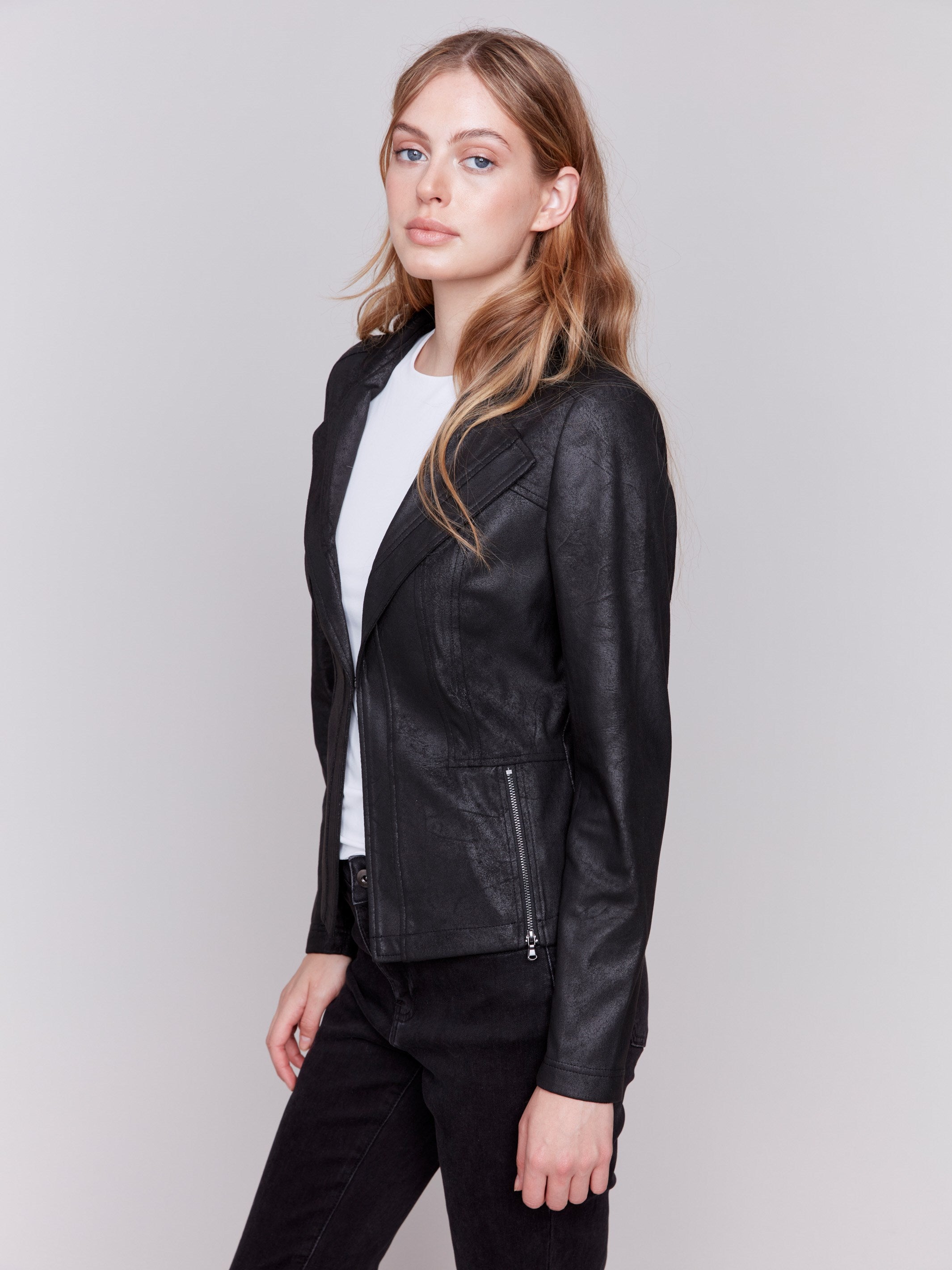 Vintage black faux leather motorcycle jacket with lapel notch collar and hook-and-eye closure by Charlie B.