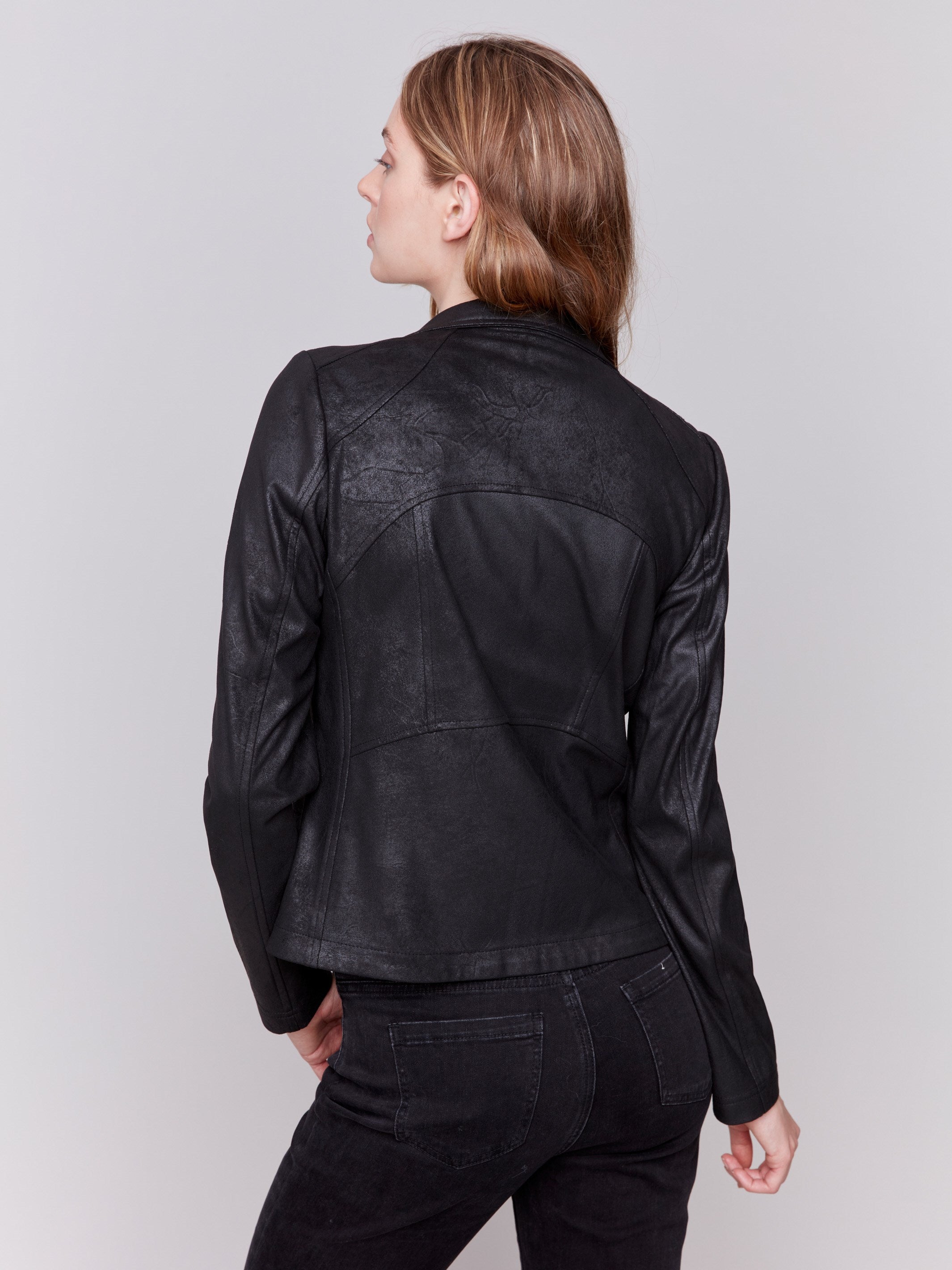 Vintage black faux leather motorcycle jacket with lapel notch collar and hook-and-eye closure by Charlie B.