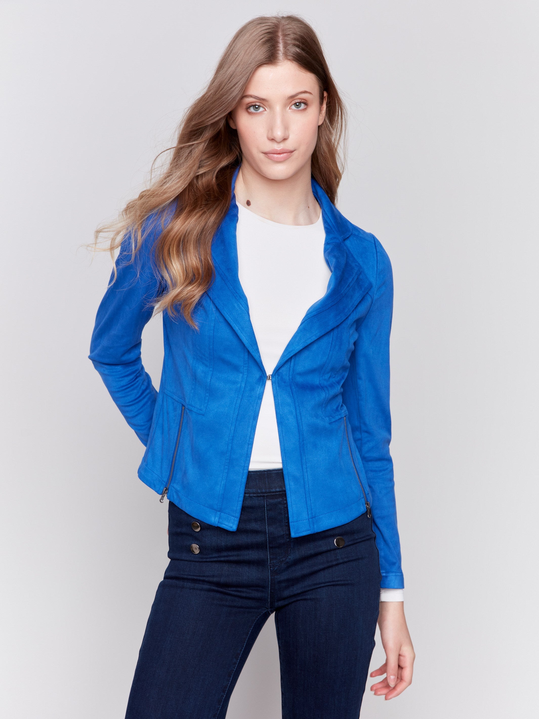 Sapphire blue faux suede jacket with silver zipper details, featuring a lapel collar and a fitted silhouette by Charlie B.